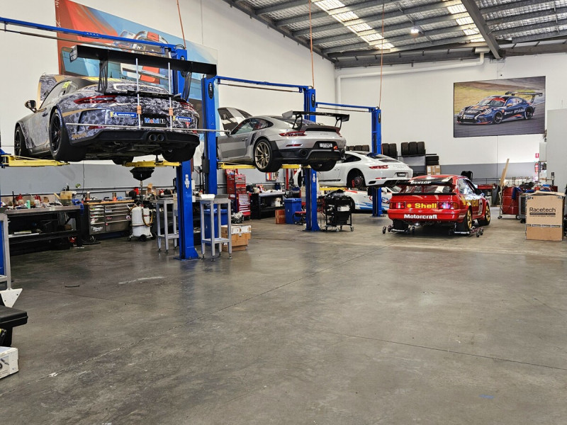 Multiple Porsche and performance cars being serviced at our fully equipped modern workshop Brisbane Gold Coast Ormeau